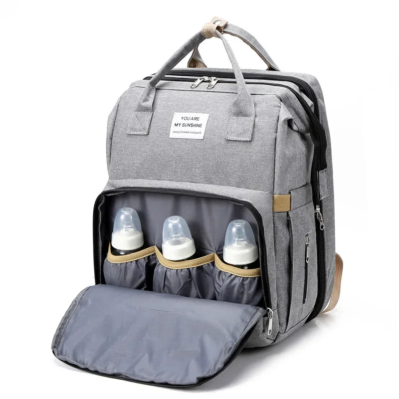 Mochila Pañalera Moderna con función de Cuna y Mudador, Diferentes Colores.